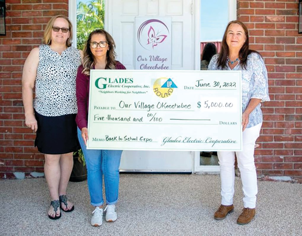 Left to right: Our Village Okeechobee Executive Director Leah Suarez and Director of Human Resources Mary O’Neal were presented $5,000 for their Back to School Expo by GECT board member Paula Byars.